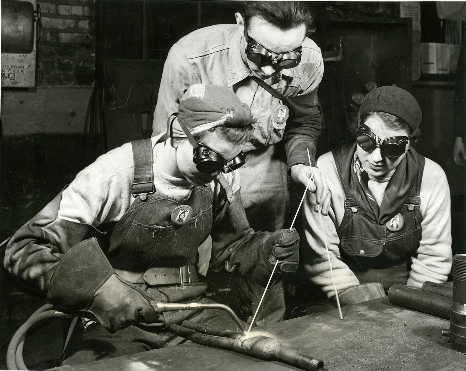 Workers on a historic tubular steel plant floor